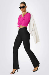 Woman in High Waist Flared Yoga Pants with V Shaped Waistband, yoga pose